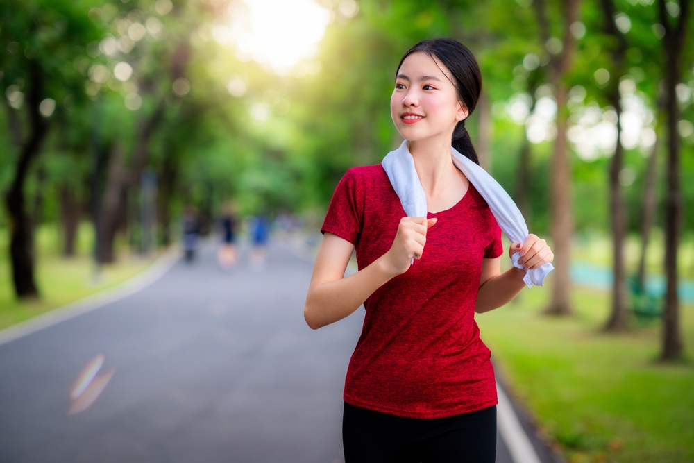 A runner jogging at a quiet park near Central Rama 9. MRTA Health Park is perfect for joggers.